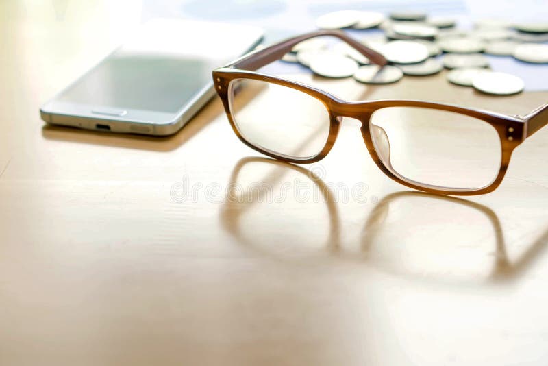 Smart phone, Coins and glasses