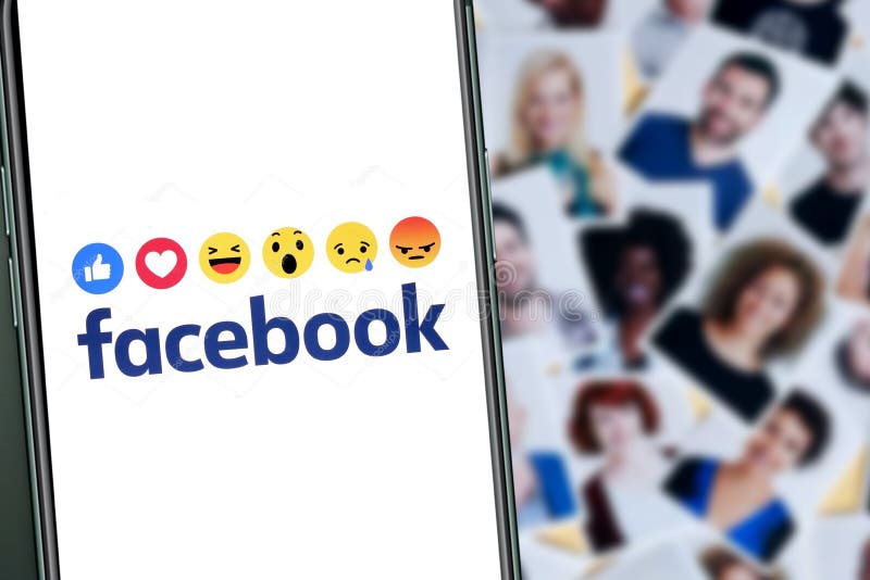 Smart phone with the FACEBOOK logo with emojis