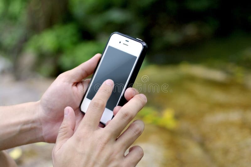 Smart phone in nature stock image