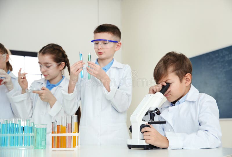 Smart pupils making experiment stock image