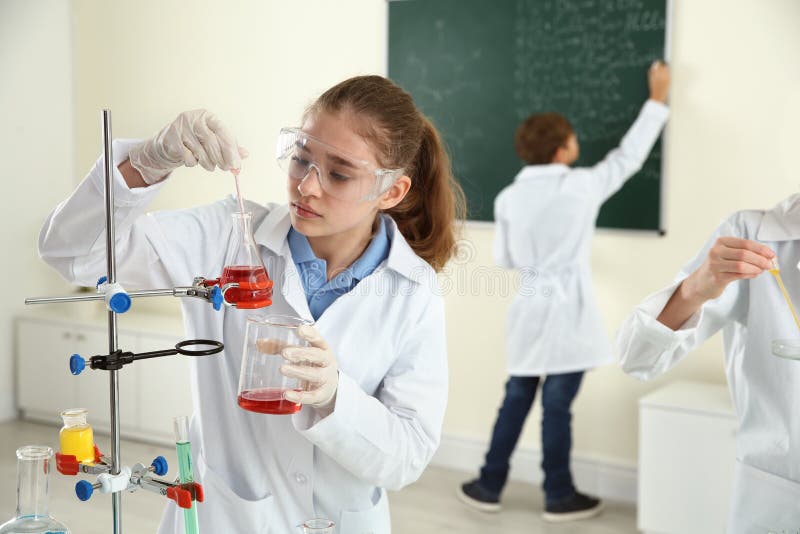 Smart pupils making experiment in class royalty free stock image