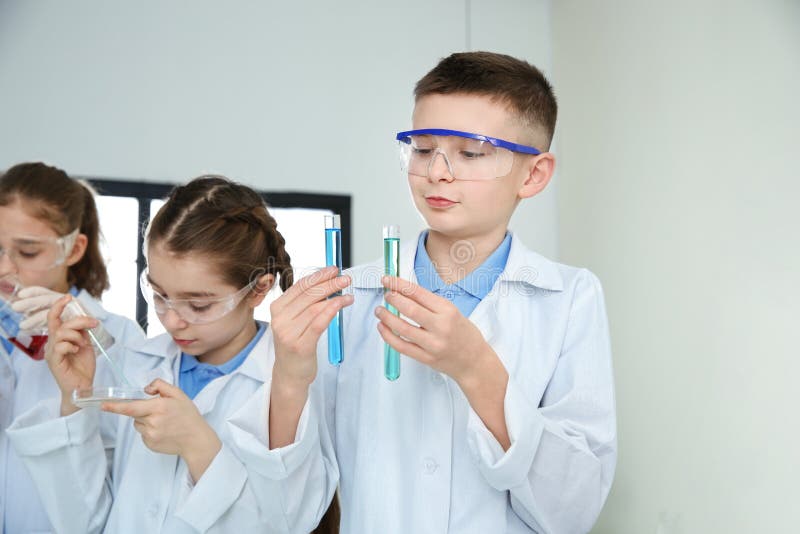 Smart pupils making experiment royalty free stock photos