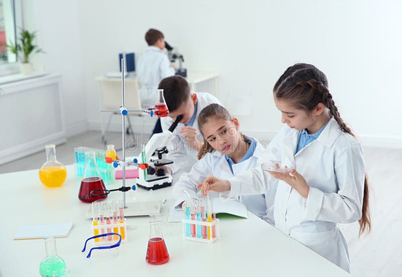 Smart Pupils Making Experiment at Table in Class Stock Image - Image of ...