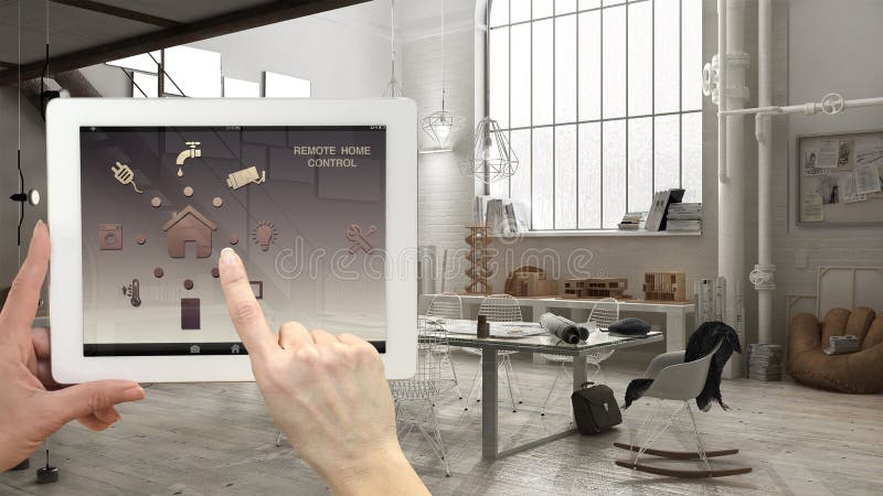 Smart remote home control system on a digital tablet. Device with app icons. Interior of industrial office in the background, arch stock photo