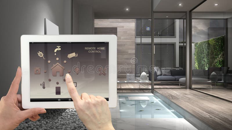 Smart remote home control system on a digital tablet. Device with app icons. Interior of minimalist house in the background, archi stock images