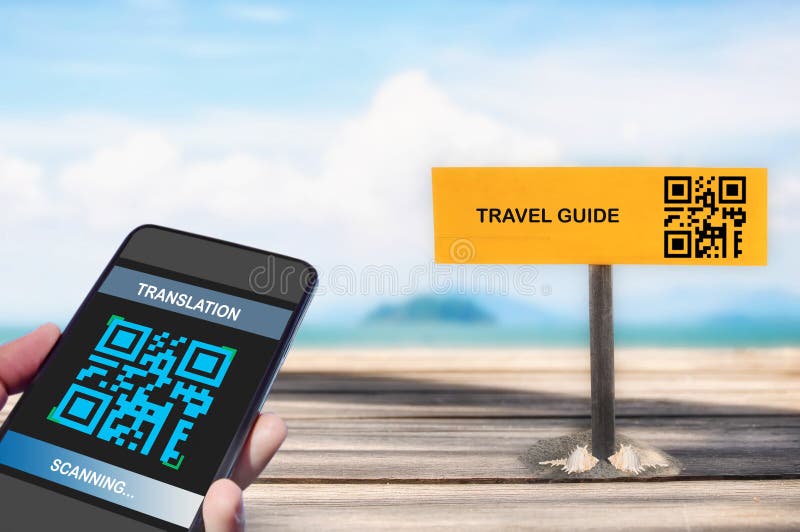 Hand holding smartphone with scanning QR code translation screen with travel guid sign on tropical beach background