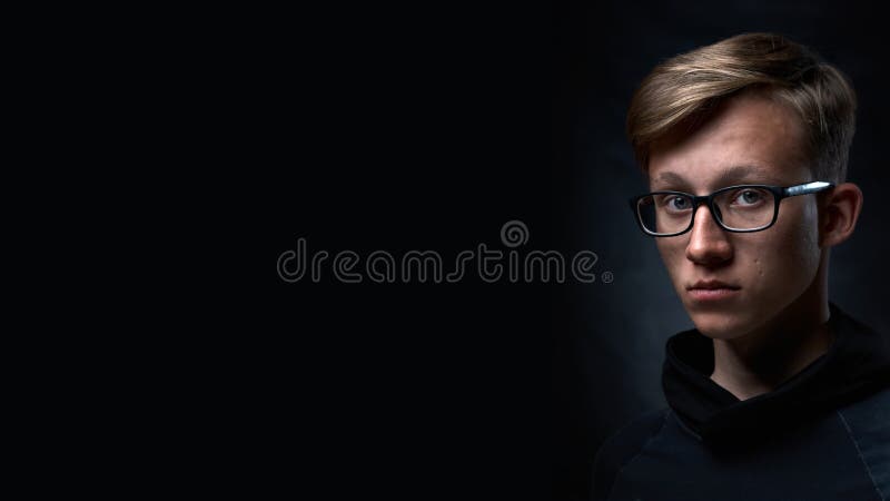 Smart Teenager with Short Hair and Glasses an Black Background. Strong and  Handsome Face Stock Image - Image of lifestyle, hood: 173151931