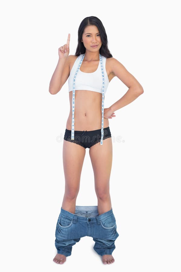 Womans Jeans Falling Down because Shes Lost Weight Stock Photo