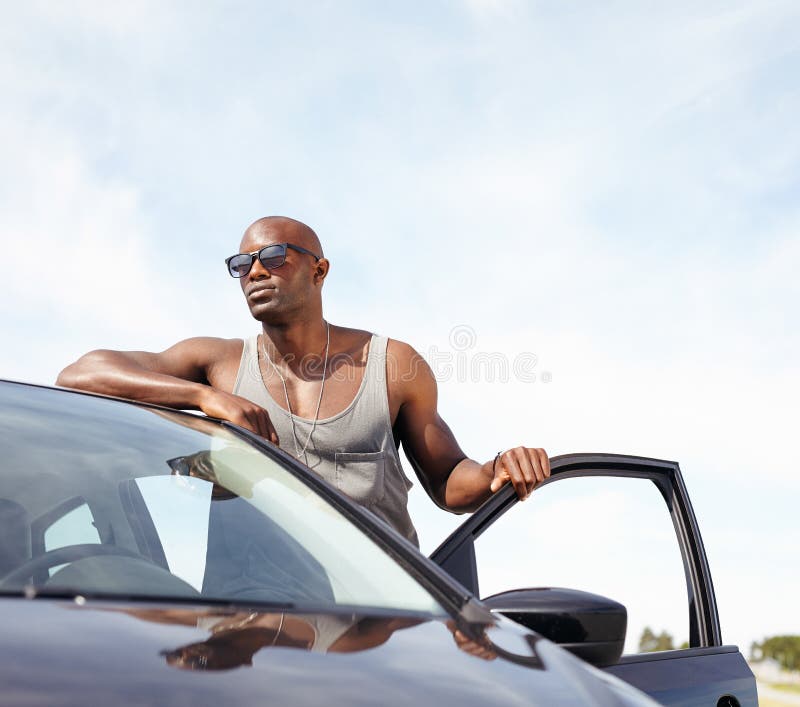 Smart young man with a car