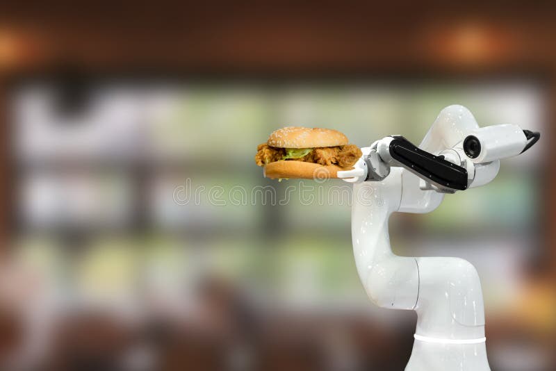 Smarta robotiska livsmedel som håller en hamburgare i den framtida automatiseringen av restaurangrobotar ökar effektiviteten arkivbild