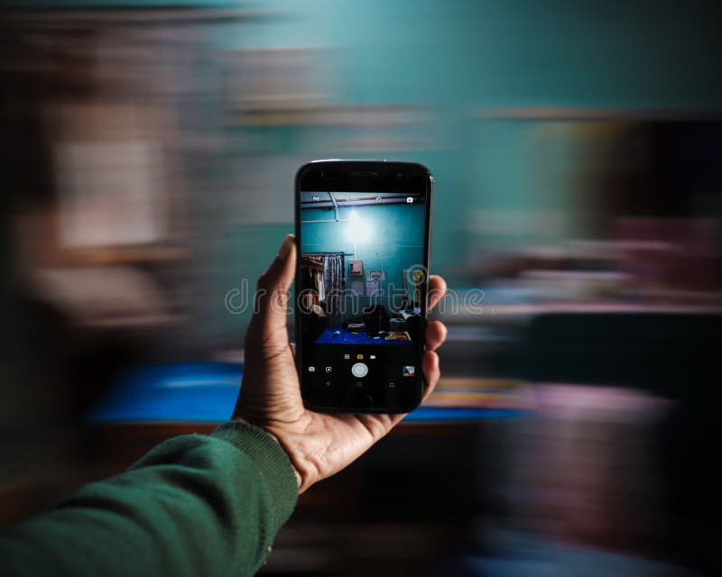 Smartphone In Hand With Motion Blur In The Background Stock Image Image of smartphone, green