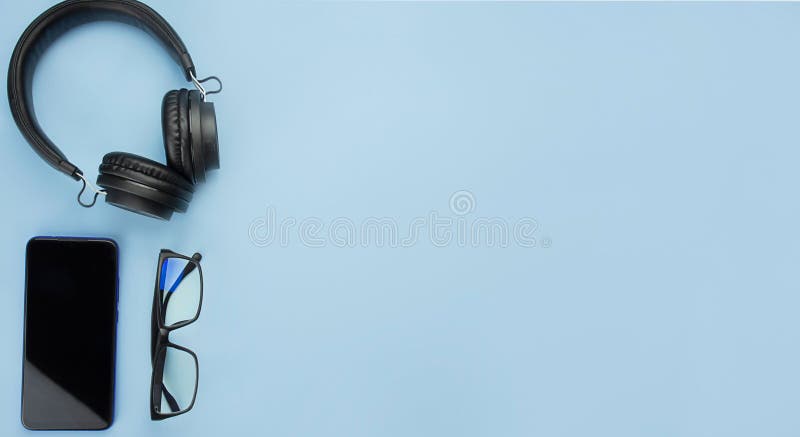 Smartphone, Headphones and Office Accessories on a Blue Background. Modern  Lifestyle. Business Concept. the Apartment Was Lying Stock Image - Image of  lifestyle, design: 181428813