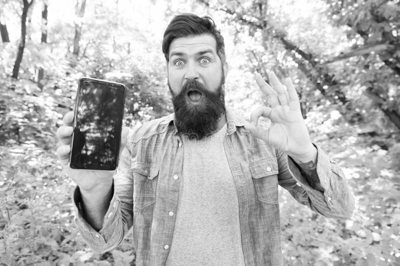 Smartphone online navigation system. Route for exciting adventure. Best GPS and navigation apps. Man bearded wanderer royalty free stock image