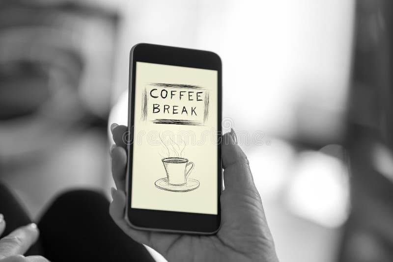 Coffee break concept on a smartphone stock photos