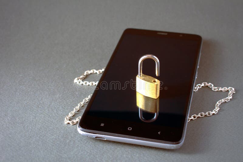 Smartphone with unlock padlock chain royalty free stock photo