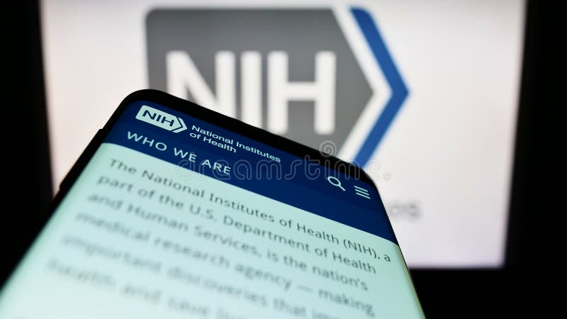 Smartphone with website of American agency National Institutes of Health (NIH) on screen in front of logo. royalty free stock image Smartphone with website of American agency National Institutes of Health (NIH) on screen in front of logo. royalty free stock image