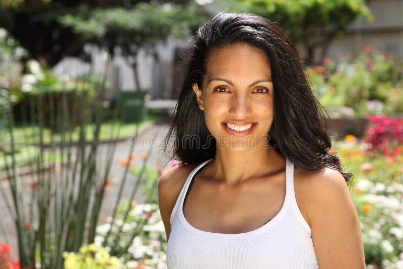 Smile from beautiful woman in garden of flowers