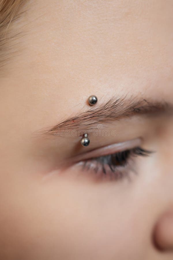 Smile or Frenulum Piercing Under the Upper Lip. Stock Photo Image of