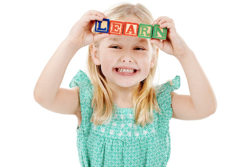 Smile, studio and face of kid with building blocks for learning, education and child development. Creative, childhood royalty free stock image
