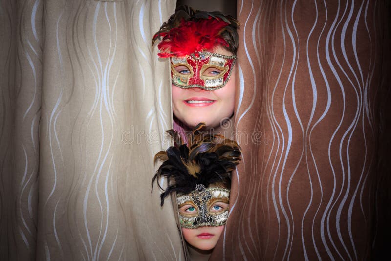 Smile teenage boy and unhappy little girl in theatrical masks royalty free stock image Smile teenage boy and unhappy little girl in theatrical masks royalty free stock image