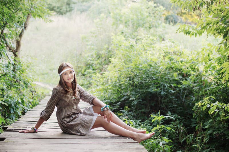 Smile teenager girl on old wooden bridge stock photo Smile teenager girl on old wooden bridge stock photo