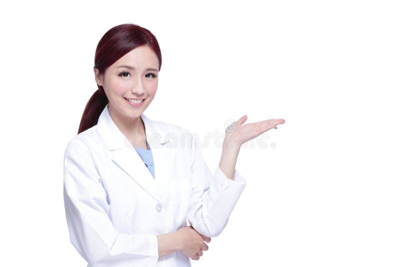 Smiling medical doctor woman show something. Isolated over white background. asian. Smiling medical doctor woman show something. Isolated over white background. asian