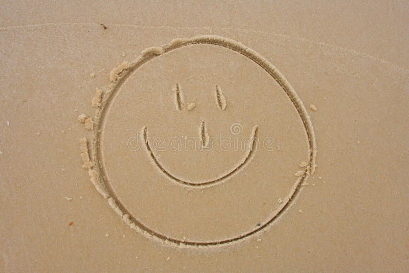 Smiley Face in the sand stock image. Image of sign, simple 1037019