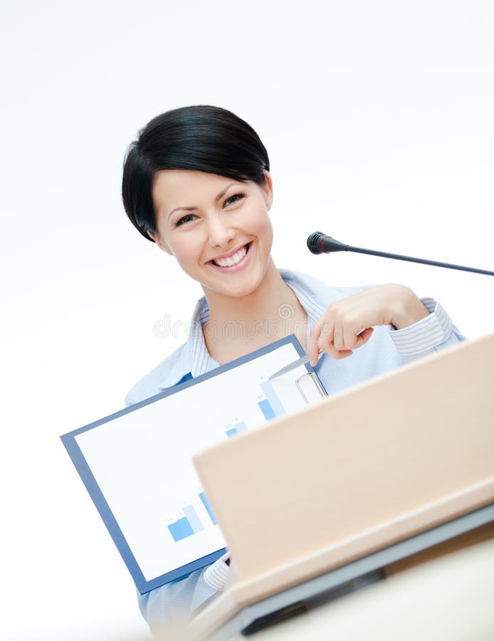 Smiley female speaker at the podium