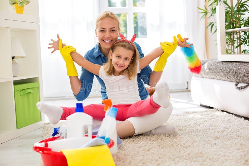 Smiling adorable family ready for cleaning house royalty free stock photo Smiling adorable family ready for cleaning house royalty free stock photo