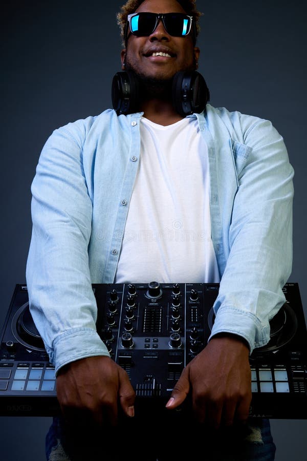 Smiling African-American DJ with an Afro Hairstyle Holds Music Equipment.  Stock Image - Image of accessories, profession: 236913219