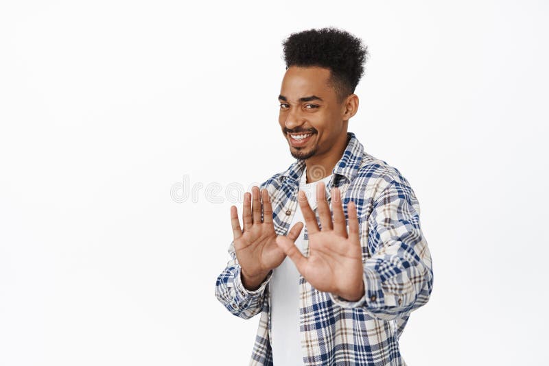 https://thumbs.dreamstime.com/b/smiling-african-american-guy-refusing-politely-look-awkward-raising-hands-stop-no-thank-you-gesture-rejecting-smiling-223215002.jpg