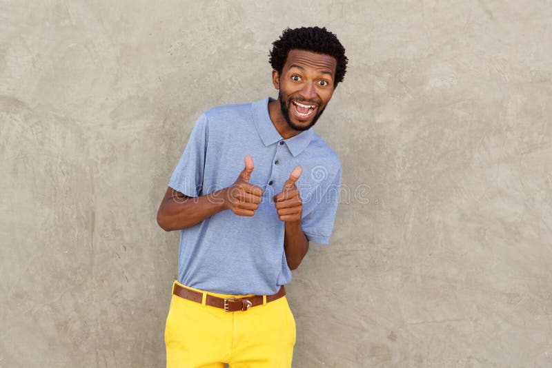 Smiling african american man with both thumbs up royalty free stock images Smiling african american man with both thumbs up royalty free stock images