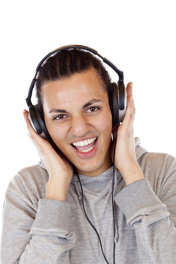 Smiling american male teenager listens to music