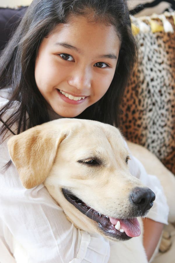 Smiling Asian girl with her pet dog