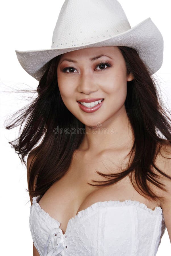 Smiling Asian woman in cowboy hat royalty free stock images