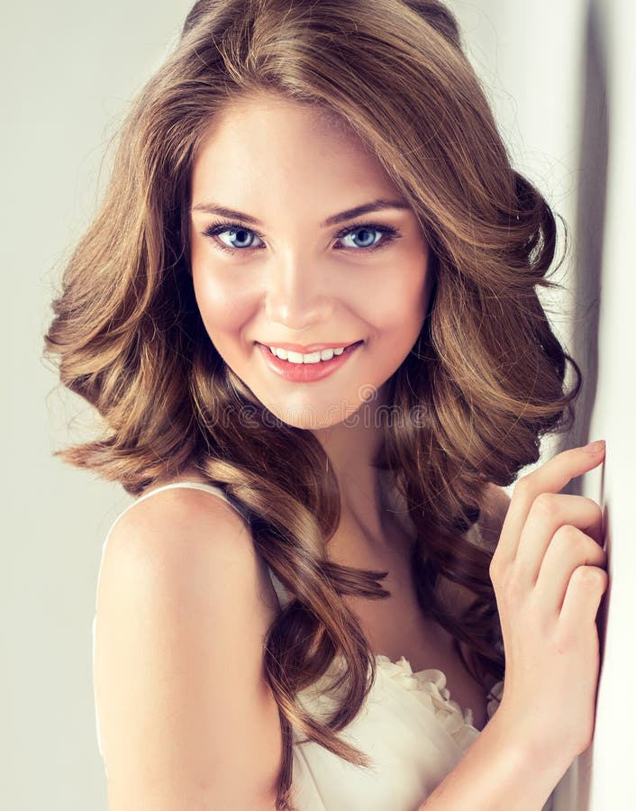 Smiling Beautiful Girl Brown Hair With An Elegant Hairstyle Hair Waves Curly Stock Image