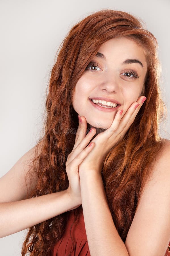 Smiling beautiful red haired girl