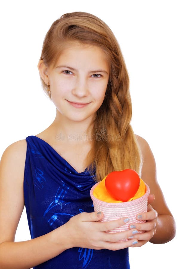 Smiling beautiful teen girl with a gift and a symbolic red heart royalty free stock images Smiling beautiful teen girl with a gift and a symbolic red heart royalty free stock images