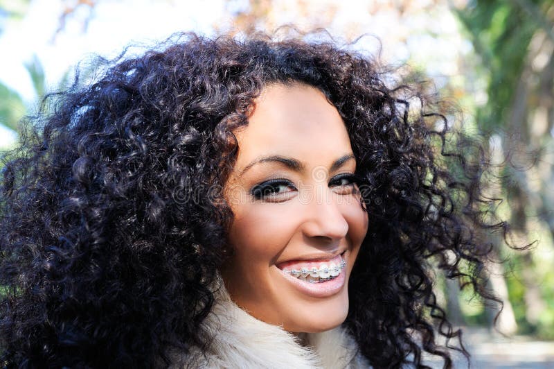 Smiling black girl with braces