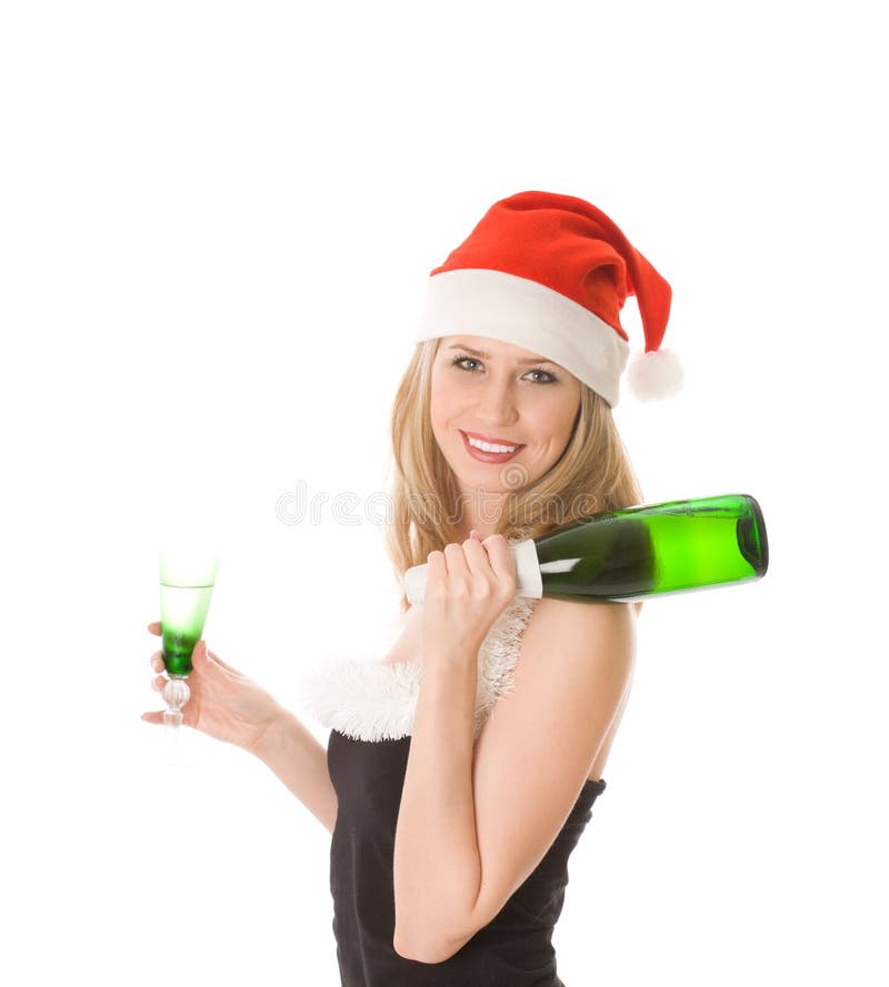 Smiling blond girl in santa hat holding bottle