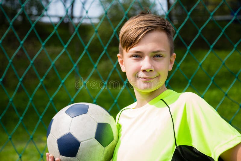 Smiling boy soccer player stock image. Image of sport - 77944833