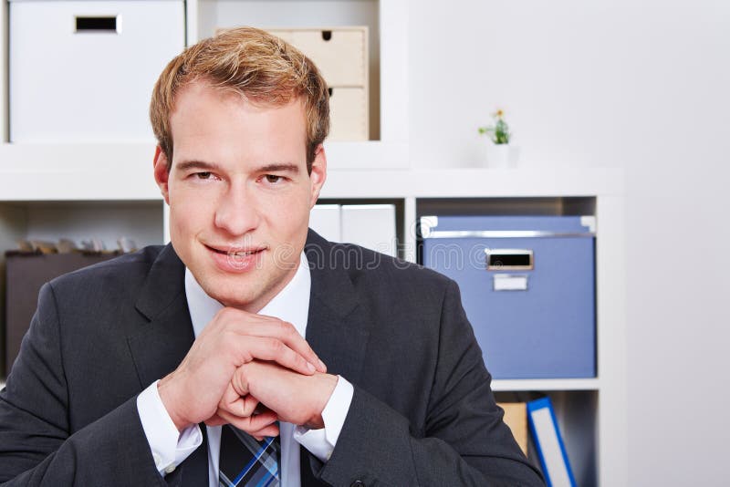 Smiling business man in office