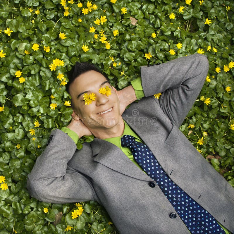 Smiling Businessman in Flower Patch stock images Smiling Businessman in Flower Patch stock images