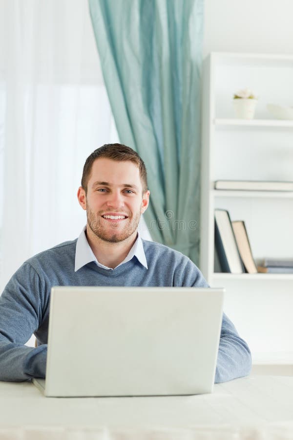 Smiling businessman in his homeoffice royalty free stock photo