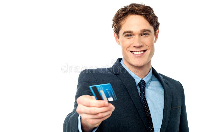 Smiling businessman offering his debit card to you royalty free stock photos Smiling businessman offering his debit card to you royalty free stock photos