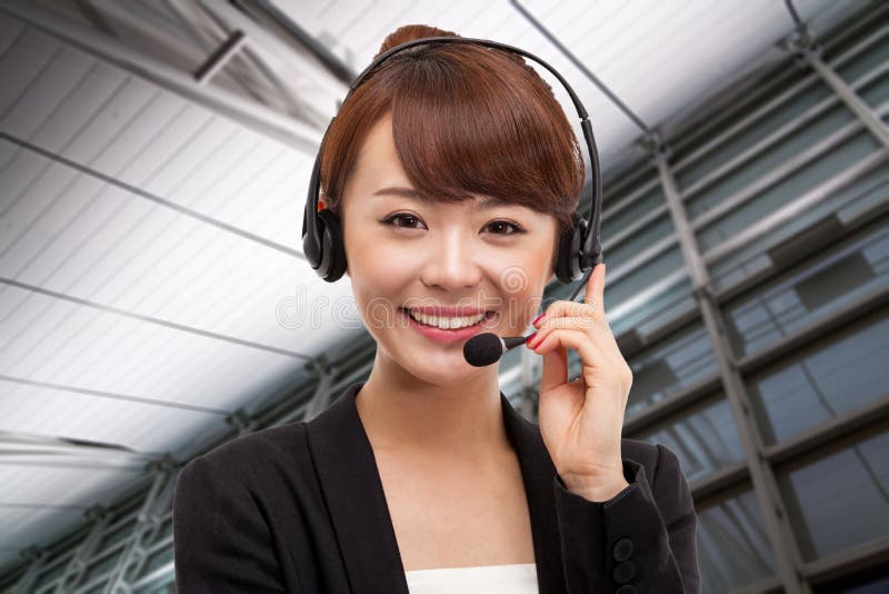 Smiling call center operator business woman