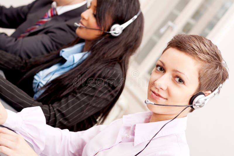 Smiling callcenter agent with headset support royalty free stock image