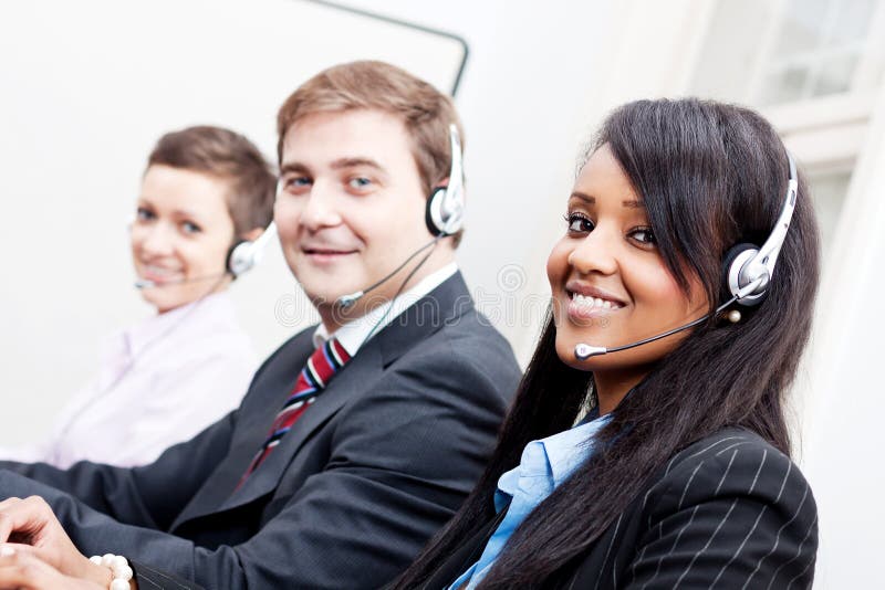 Smiling callcenter agent with headset support stock image