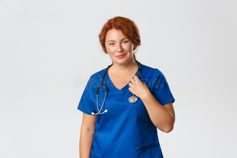 Smiling Caring Middle Aged Redhead Doctor Female Physician In Blue