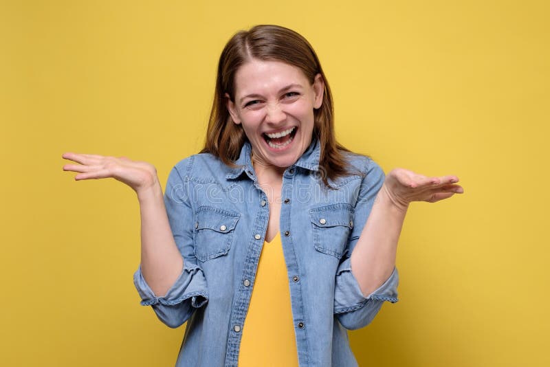 Smiling Caucasian Woman Spreading Hands Showing On Both Sides